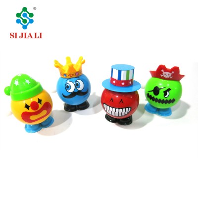 Promotional ABS Funny Spring Wind Up Jumping Expression Doll Toys